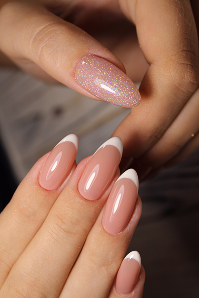 Woman hands with French manicure
