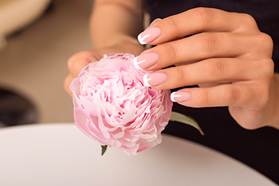 Woman hands with French manicure