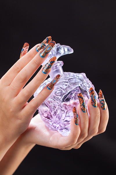 Well-manicured hands featuring intricate nail art