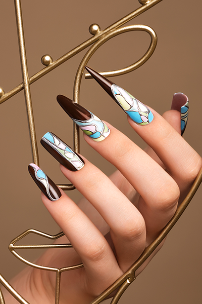 Well-manicured hands with intricate nail art design